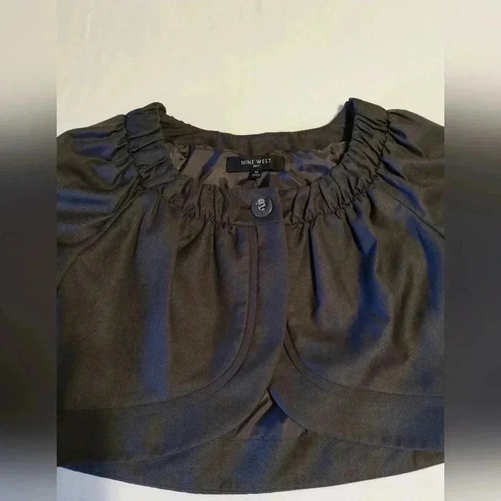Grey Nine West cropped jacket over dress